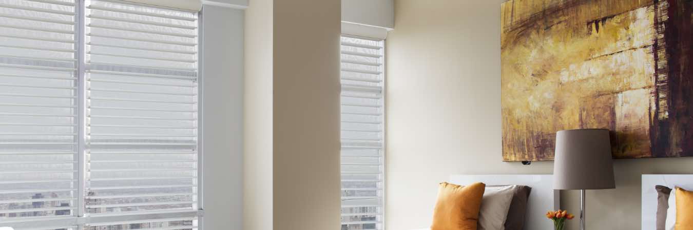 White sheer shades on a bedroom window